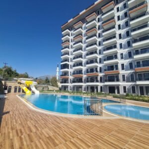 Современная квартира 1+1 в районе Демирташ — 850 м до моря, развитая инфраструктура.