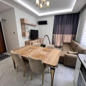 Продажа квартиры 1+1 в Махмутларе — 55 м², меблированная, с бассейном и фитнесом.