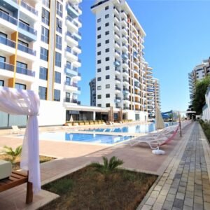 Меблированная квартира 1+1 с полной инфраструктурой в новом комплексе в районе Махмутлар!