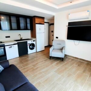 Меблированные двухкомнатные апартаменты с собственным садом в Махмутларе.