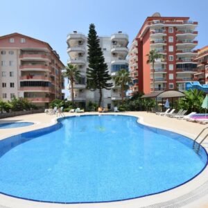 Уютная меблированная квартира 2+1 в комплексе на первой линии, в Махмутларе.