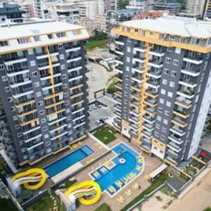 Современные апартаменты с планировкой 2+1 в новом жилом комплексе в Махмутларе, Аланья.