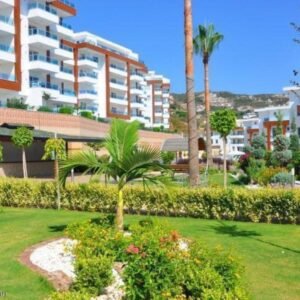 Просторный садовый дуплекс 4+1 в Каргыджак, Аланья.