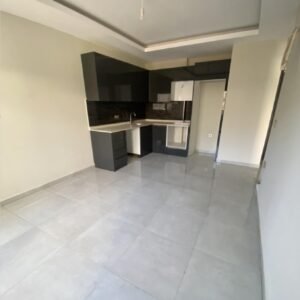 Апартаменты 1+1 с видом на горы в жилом комплексе с инфраструктурой в Махмутларе.