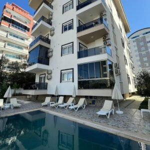 Меблированная квартира 1+1 в Махмутларе — всего 400 метров до пляжа!