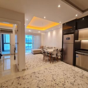 Уютная меблированная квартира формата 1+1 в современном жилом комплексе в Махмутларе.