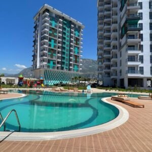 Продается уютная квартира 1+1 в современном 13-этажном комплексе в Махмутларе.