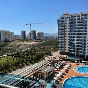 Апартаменты 1+1 в элитном комплексе с видом на море в районе Махмутлар.