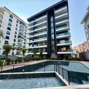 Современный жилой комплекс в центре Аланьи — инвестиции и комфорт у моря.